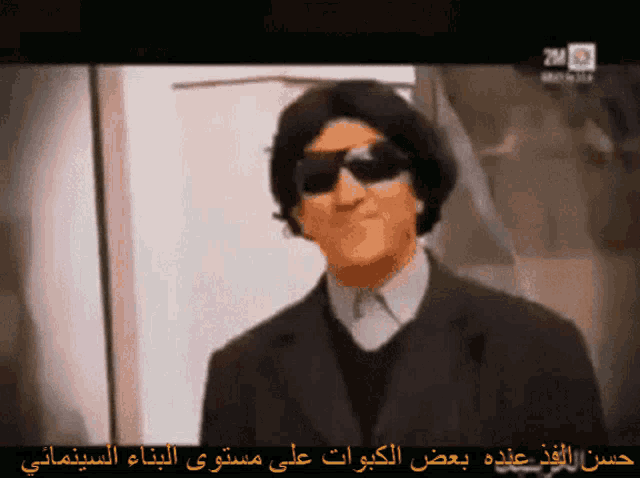 a cartoon of a man wearing sunglasses and a black suit