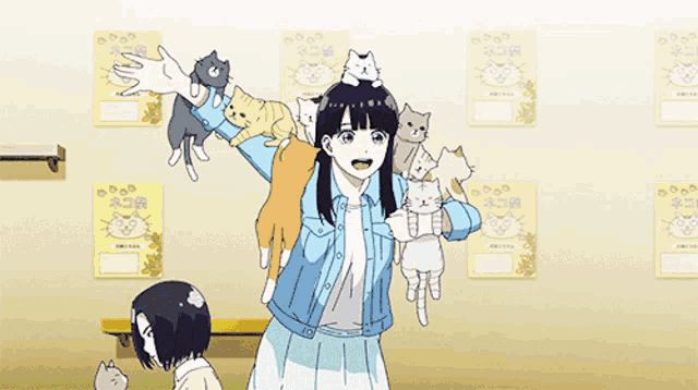 a girl is surrounded by cats in a room with posters on the wall that say " cats "
