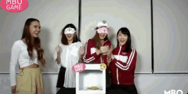 a group of young women are playing a game called mbo game