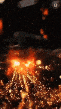 a blurred image of a fire with a m on the bottom