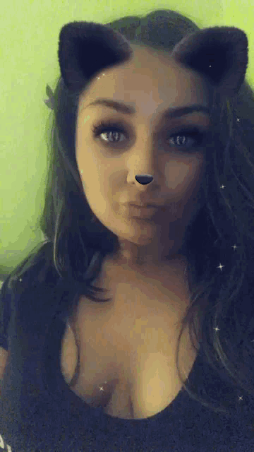 a woman wearing a cat ear filter on her face