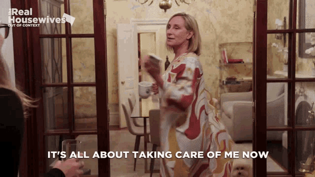 a real housewives ad shows a woman standing in front of a door