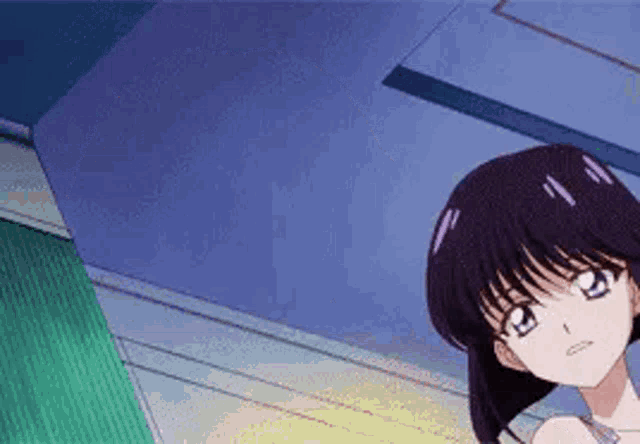 a girl with purple hair and blue eyes is standing in a room looking up at the ceiling .