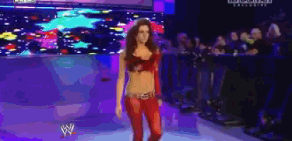 a pixelated image of a woman walking on a stage with the letters w on the bottom