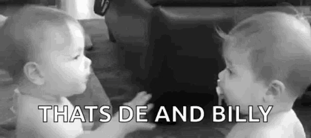 two babies are looking at each other in a black and white photo with the words `` that 's de and billy '' .