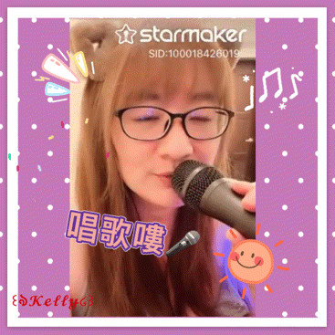 a girl singing into a microphone with a starmaker watermark on the bottom