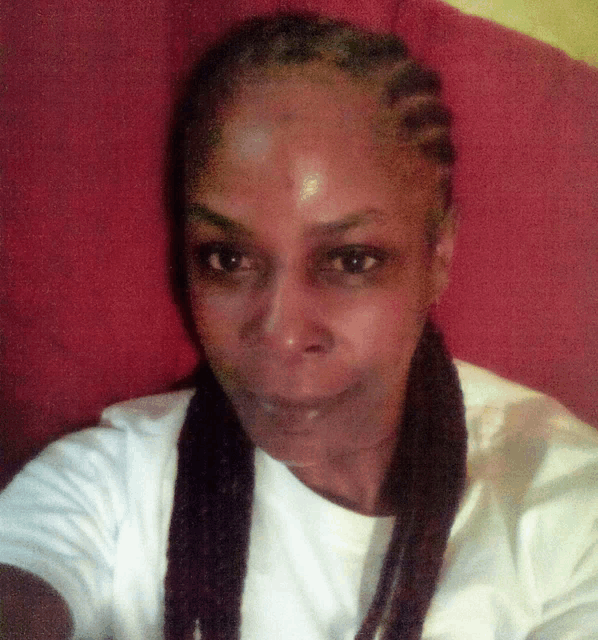 a woman taking a selfie with dreadlocks on her head