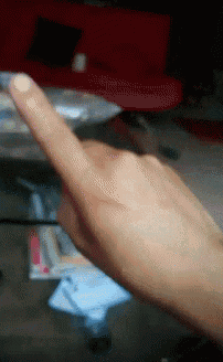 a close up of a person 's finger pointing