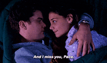 a man and a woman are laying in bed looking at each other and the woman says " and i miss you pace "
