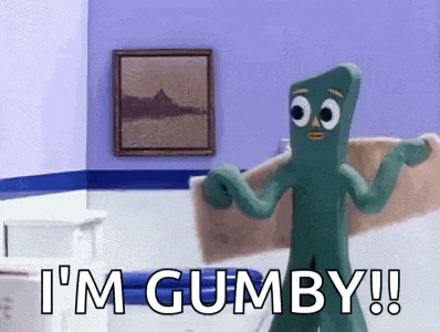 gumby the squid is holding a towel in a bathroom .