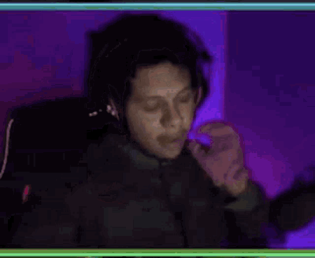 a blurry picture of a person wearing headphones .