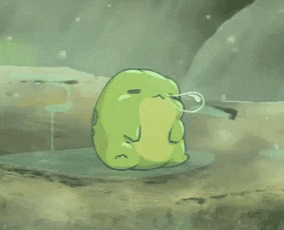 a green frog is sitting on a rock with a bubble coming out of it 's mouth .