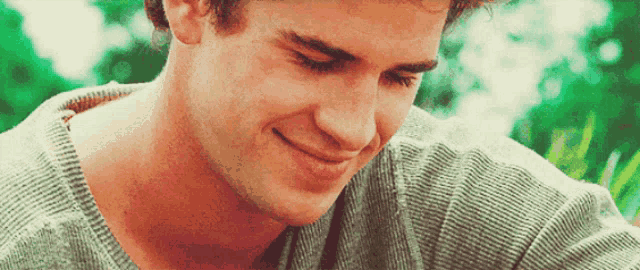 a close up of a man 's face smiling