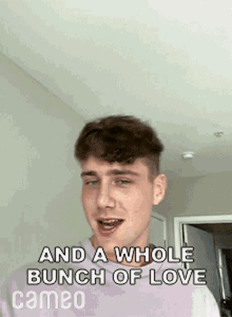 a young man is making a funny face with the words and a whole bunch of love cameo .