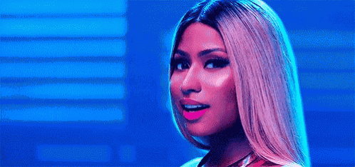 a close up of a woman 's face with a blue background and a pink lip .