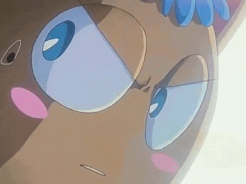 a close up of a cartoon character 's face with blue eyes and a pink nose .