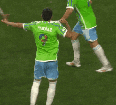 a soccer player wearing a green shirt with the name ruidiaz on it