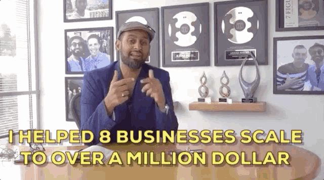 a man sitting at a desk with the words " helped 8 businesses scale to over a million dollar " behind him