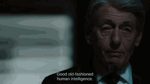 a man in a suit and tie says good old fashioned human intelligence