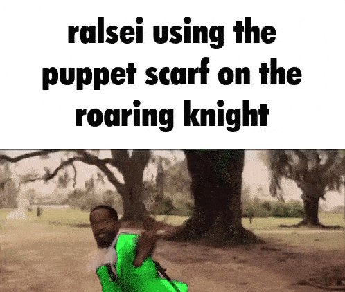 a man wearing a green puppet scarf is standing in front of a tree .