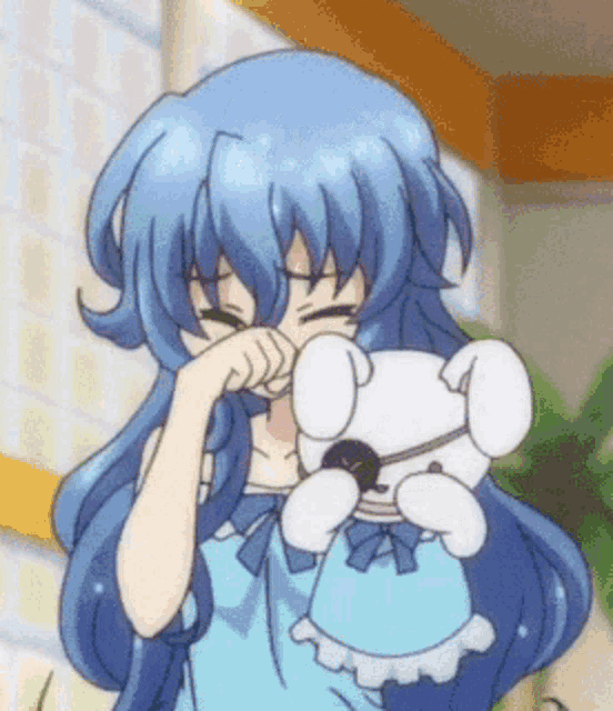 a girl with blue hair is holding a white stuffed animal