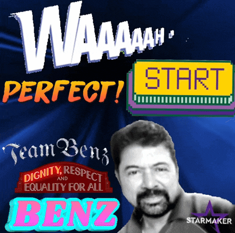 a man with a beard stands in front of a start button