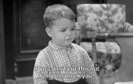 a black and white photo of a little boy saying if you don t cut this out i 'm gonna sock you