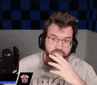 a man wearing headphones and a shirt that says nvp