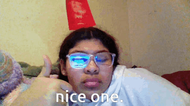 a girl wearing glasses giving a thumbs up and the words nice one