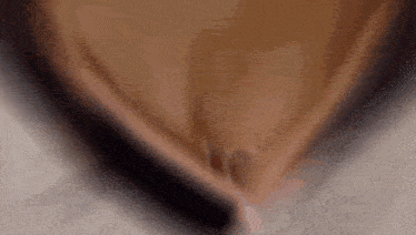 a close up of a woman 's bottom with a blurred background .