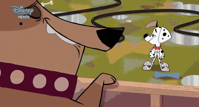 a dalmatian dog is looking at another dalmatian dog in a disney premiere