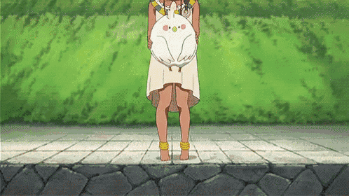 a woman in a white dress is holding a stuffed animal in her hands .