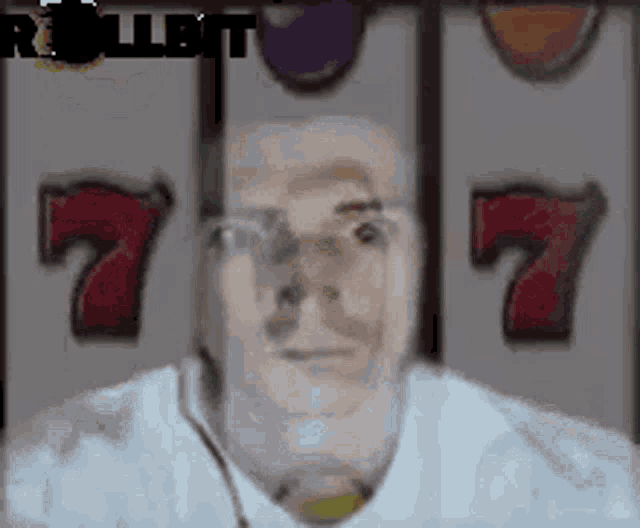 a man is sitting in front of a slot machine with the number 7 on it .