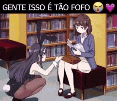 a girl in a bunny costume is petting another girl 's knee