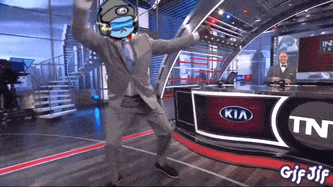 a man is dancing in front of a kia sign