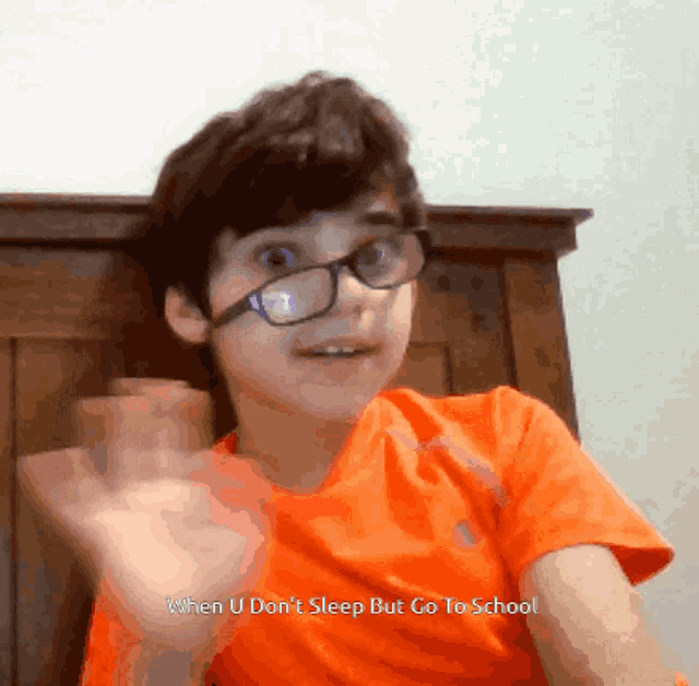 a young boy wearing glasses says when u don 't sleep but go to school