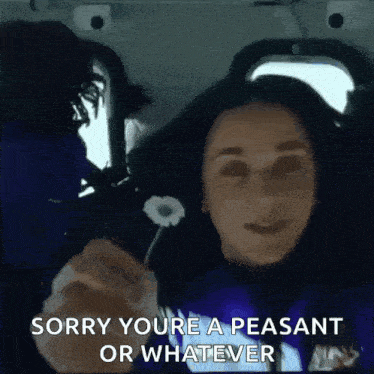 a woman in a car is holding a flower and says sorry you 're a peasant or whatever