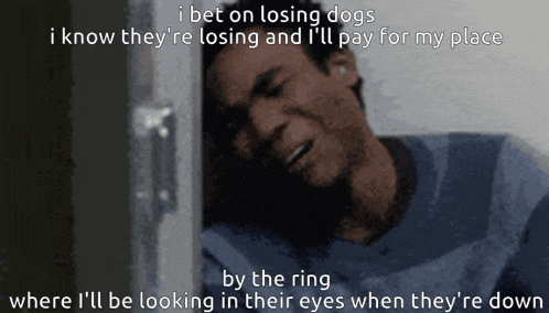 a man laying down with the words i bet on losing dogs i know they 're losing