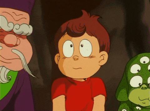 a boy in a red shirt is standing next to a green dog