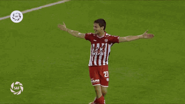 two soccer players are hugging each other and one has the number 16 on his back