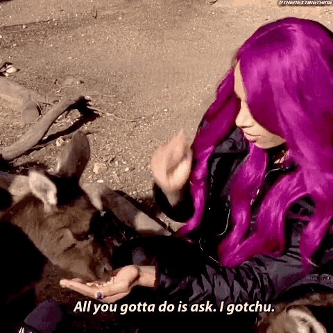 a woman with purple hair says " all you gotta do is ask . i gotchu "