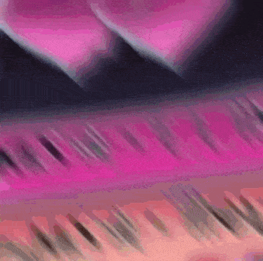 a close up of a pink piano keyboard with a heart behind it