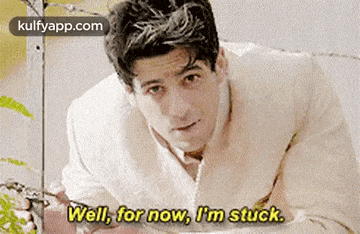 a man in a white robe is saying `` well , for now , i 'm stuck . '' .