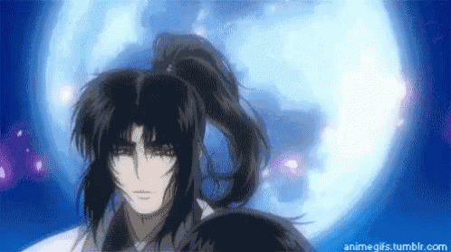 a man in a ponytail is standing in front of a full moon .