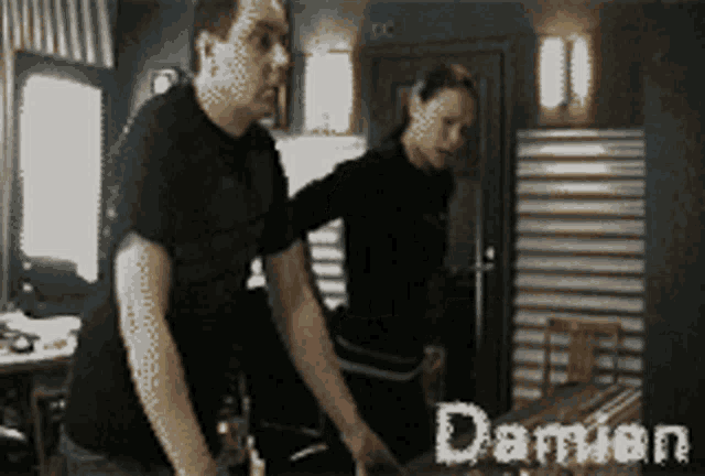 a man and a woman are standing next to each other with the name damian written on the bottom
