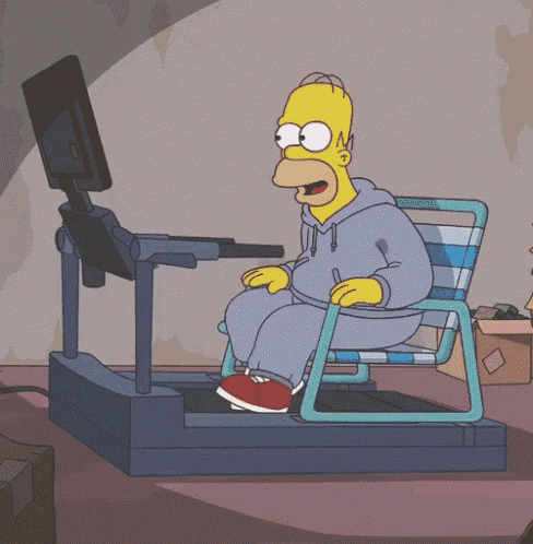 homer simpson is sitting on a treadmill in front of a monitor