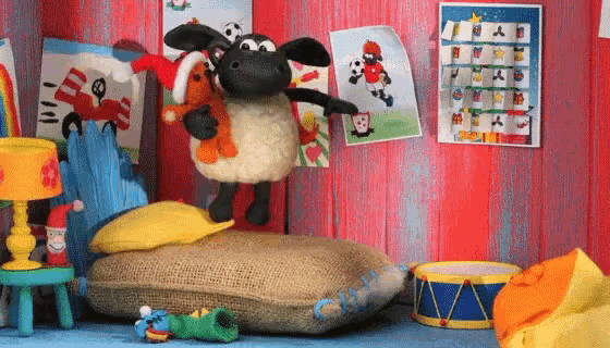a cartoon sheep holding a stuffed animal in a room