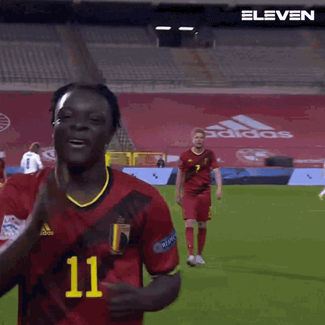 a soccer player with the number 11 on his shirt
