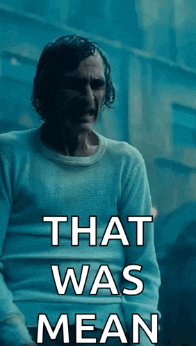 a man in a white sweater with the words that was mean on it