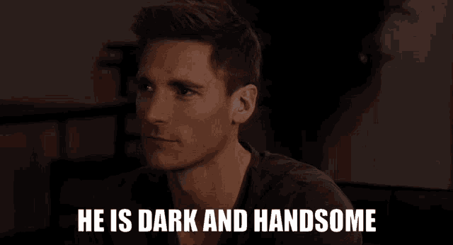 a man says he is dark and handsome in front of a black background